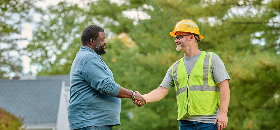 Customer shaking hands with Consumers Energy Employee